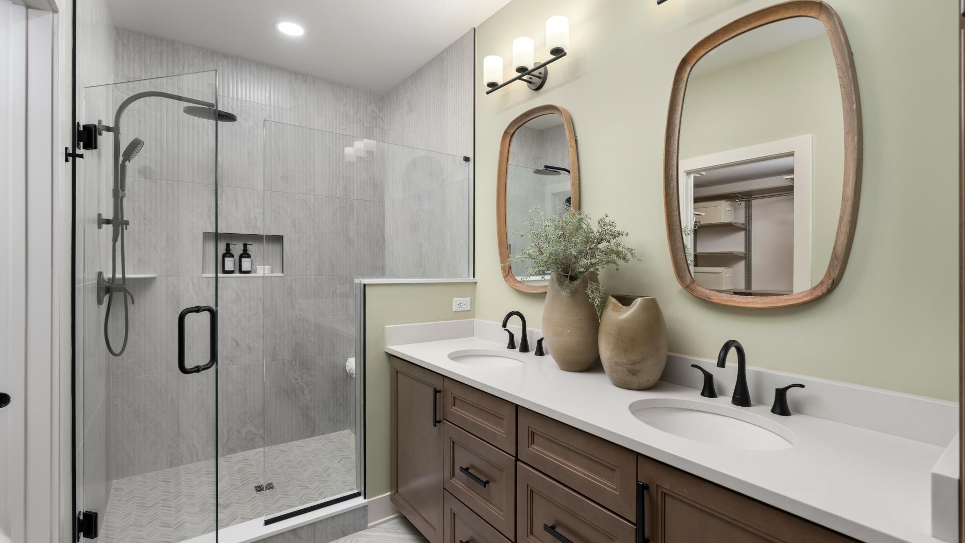 Spa-like primary bath with dual-sink vanity and luxe shower 