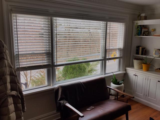 This custom installation in Croton-on-Hudson covers a trio of ganged windows with Wood Blinds by Budget Blinds of Ossining that can be adjusted independently, but only have one Valance. #BudgetBlindsOssining #CustomValances #WoodBlinds #BlindedByBeauty #FreeConsultation #WindowWednesday