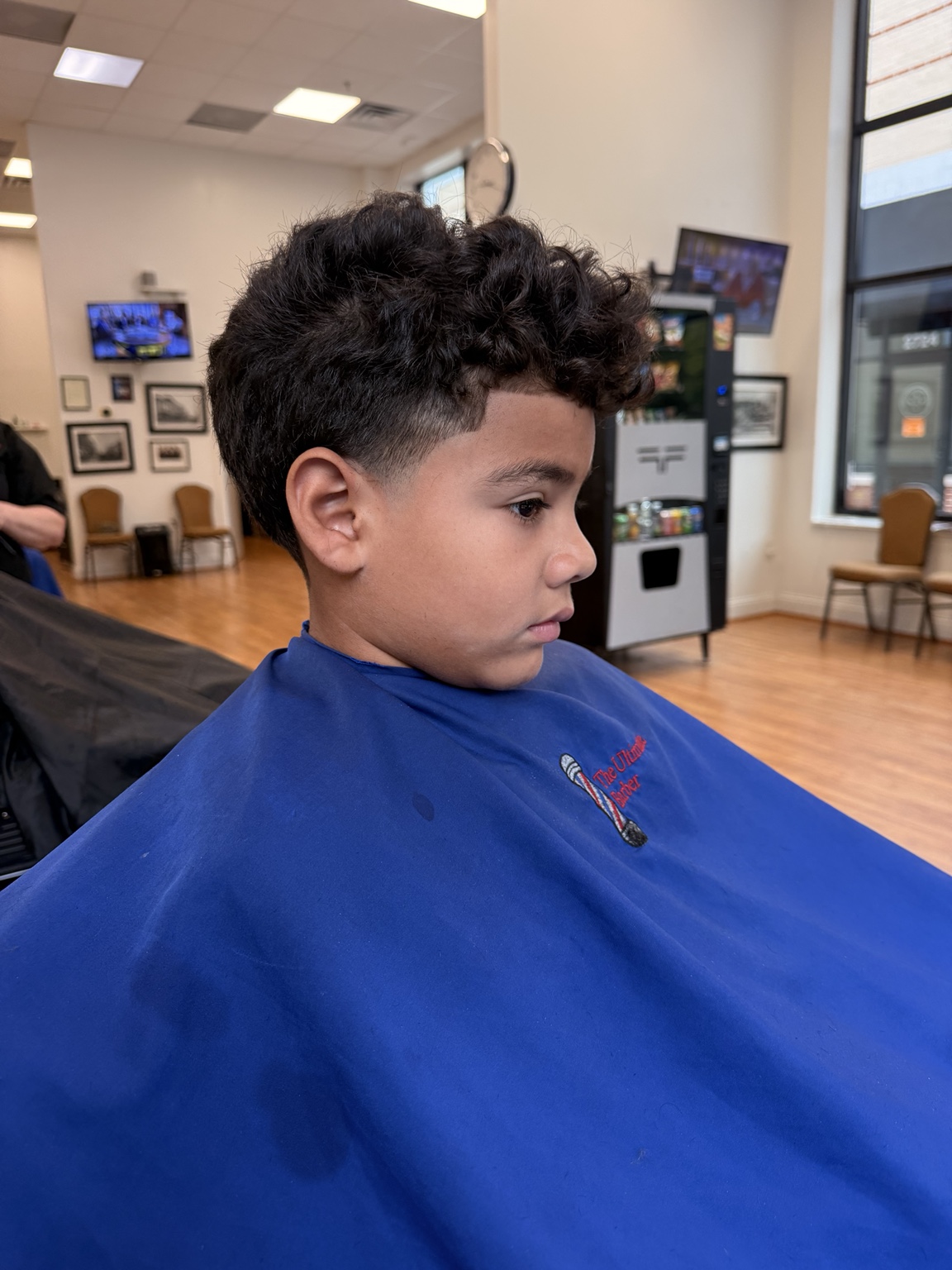 Kids' haircut at The Ultimate Barber in Alexandria, VA - side view.