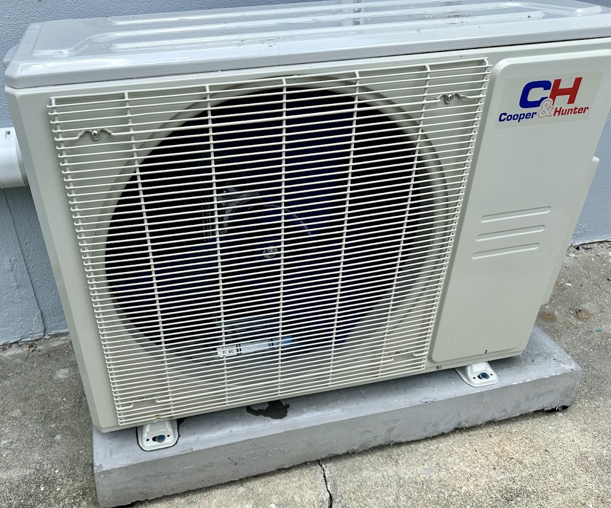 Outdoor mini-split condenser installed for efficient ductless heating and cooling performance.
