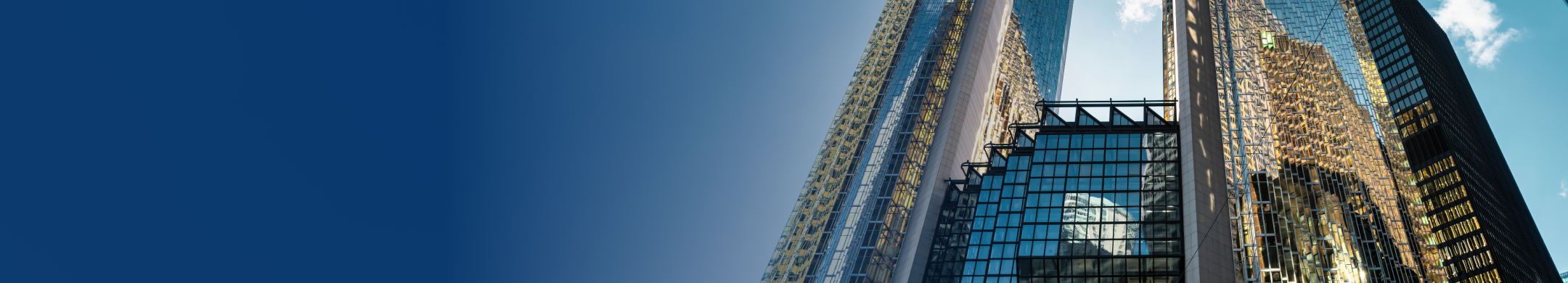 A bottom-up view of Royal Bank Plaza with a clear blue sky in the background.