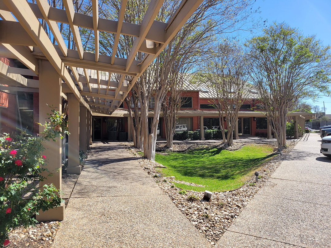 Walkway leading to the Great Hills FastFit Studio building entrance