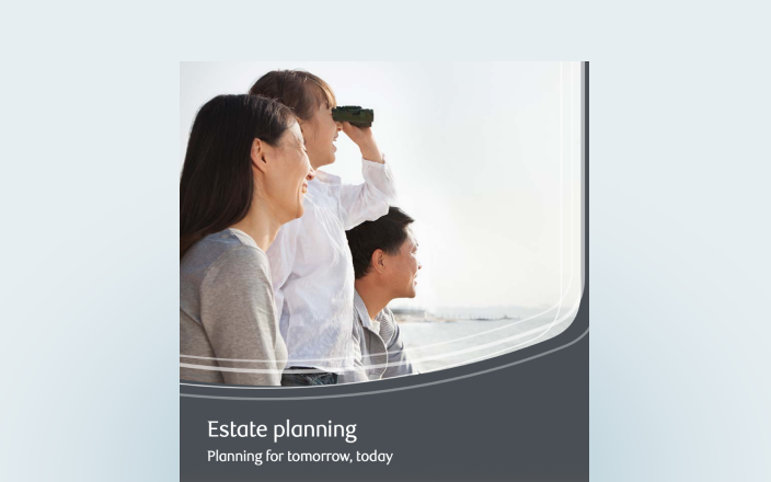 Cover of the estate planning guide featuring a family using binoculars as they overlook a body of water.