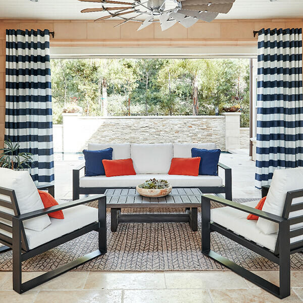 Outdoor drapery is durable enough to withstand the elements and can provide extra shade when entertaining guests.