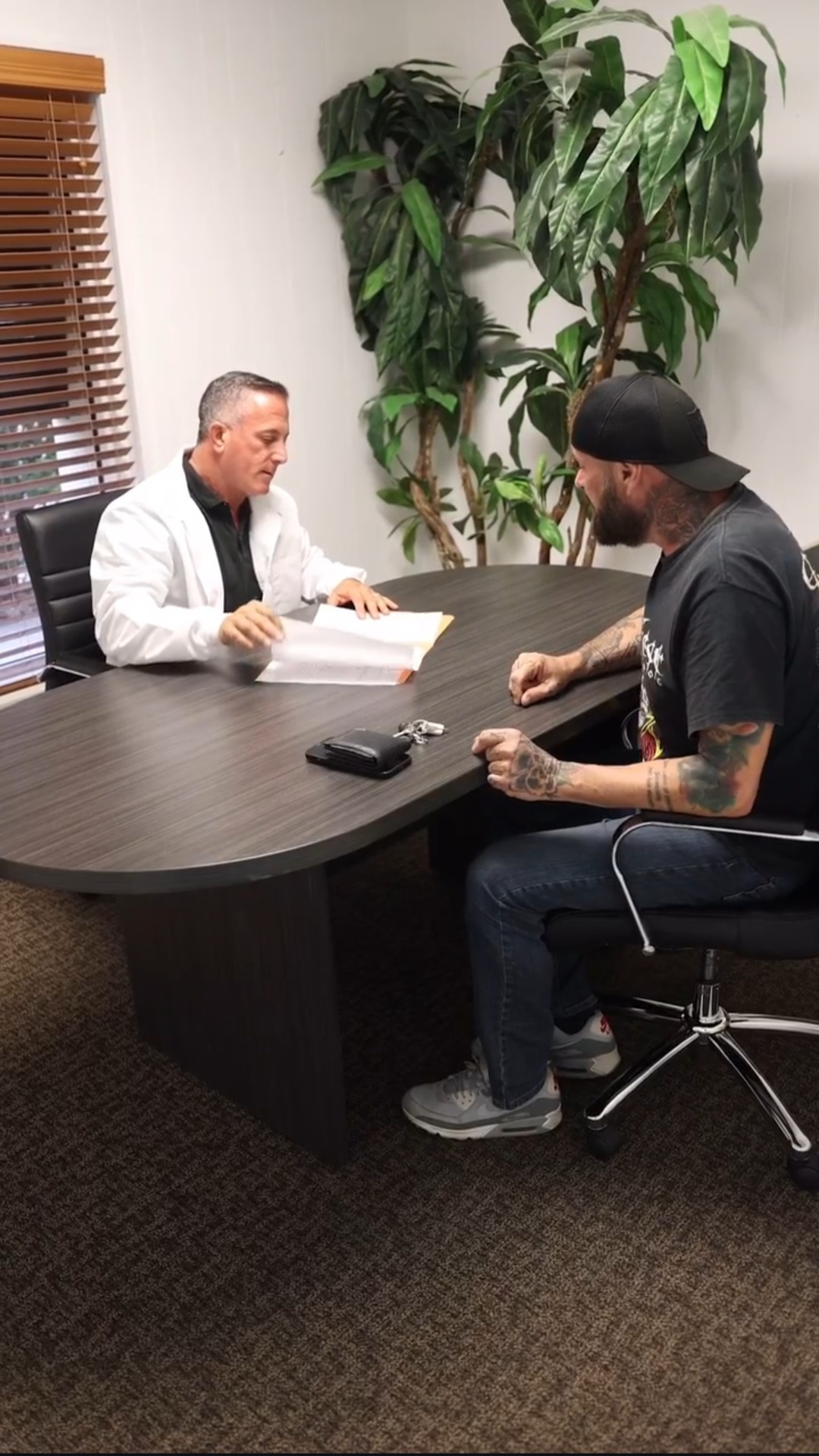 Chiropractor Dr. Badalamente discussing treatment plan