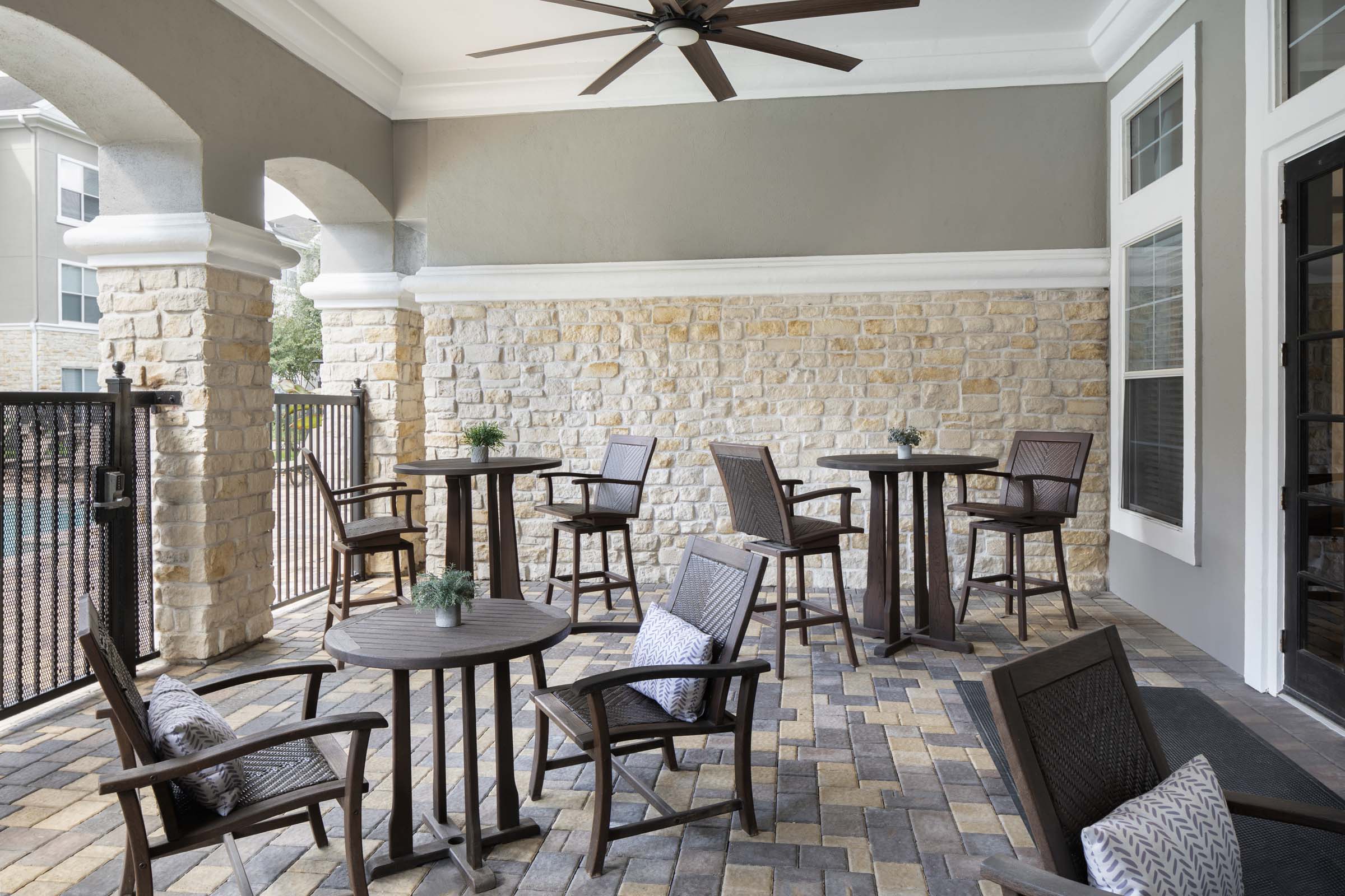 Outdoor lounge with TV at Camden Spring Creek Apartments in Spring, Texas
