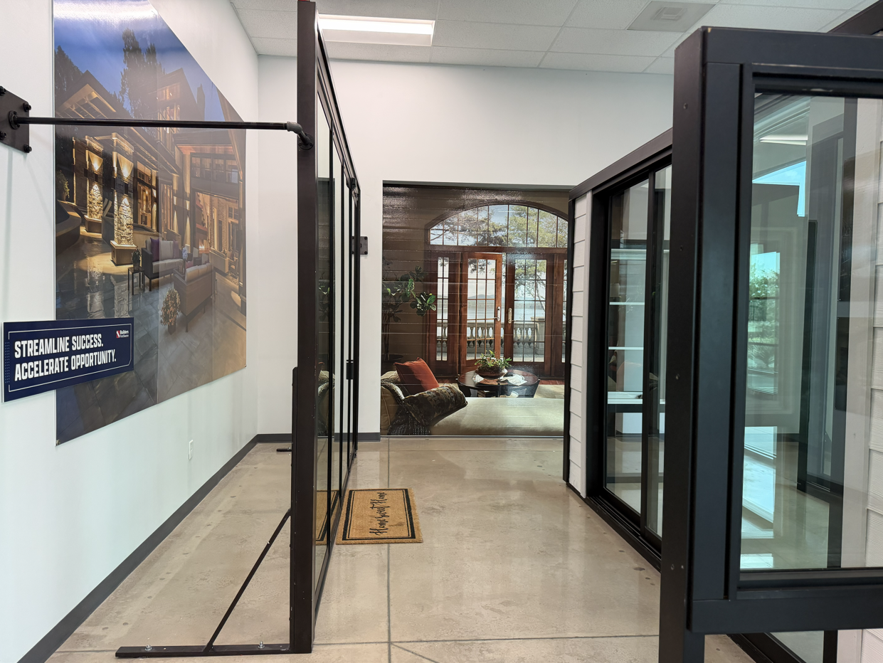 Interior view of the Builders FirstSource Premium Window Showroom featuring large window displays, p 