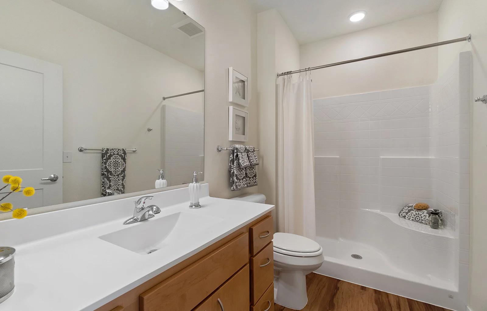 Bathroom with Walk-in Shower at Oaks Landing Apartments