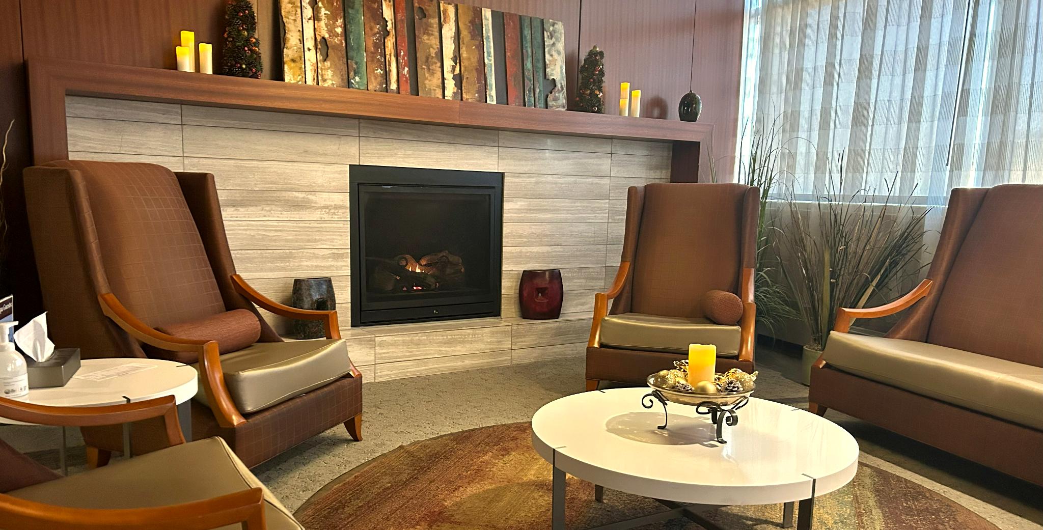 Spa lounge seating area with warm lighting and modern furnishings