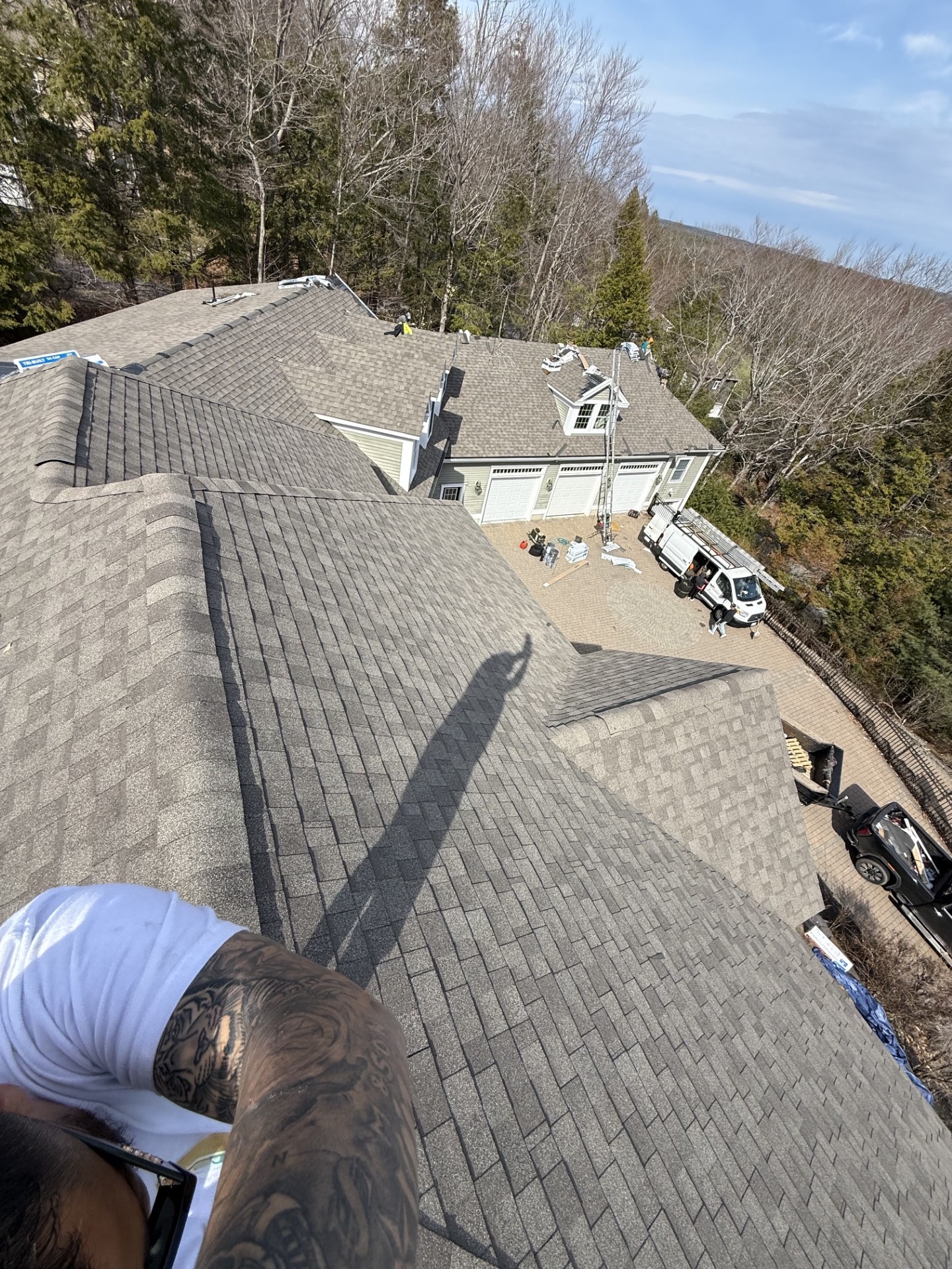Residential roof replacement project featuring architectural asphalt shingles professionally installed by M & Son Construction.