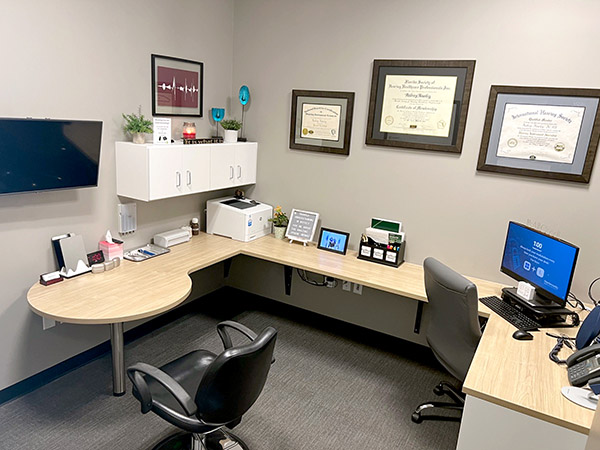 Interior photo of the hearing consultation office of AudioNova hearing clinic in Leesburg, FL