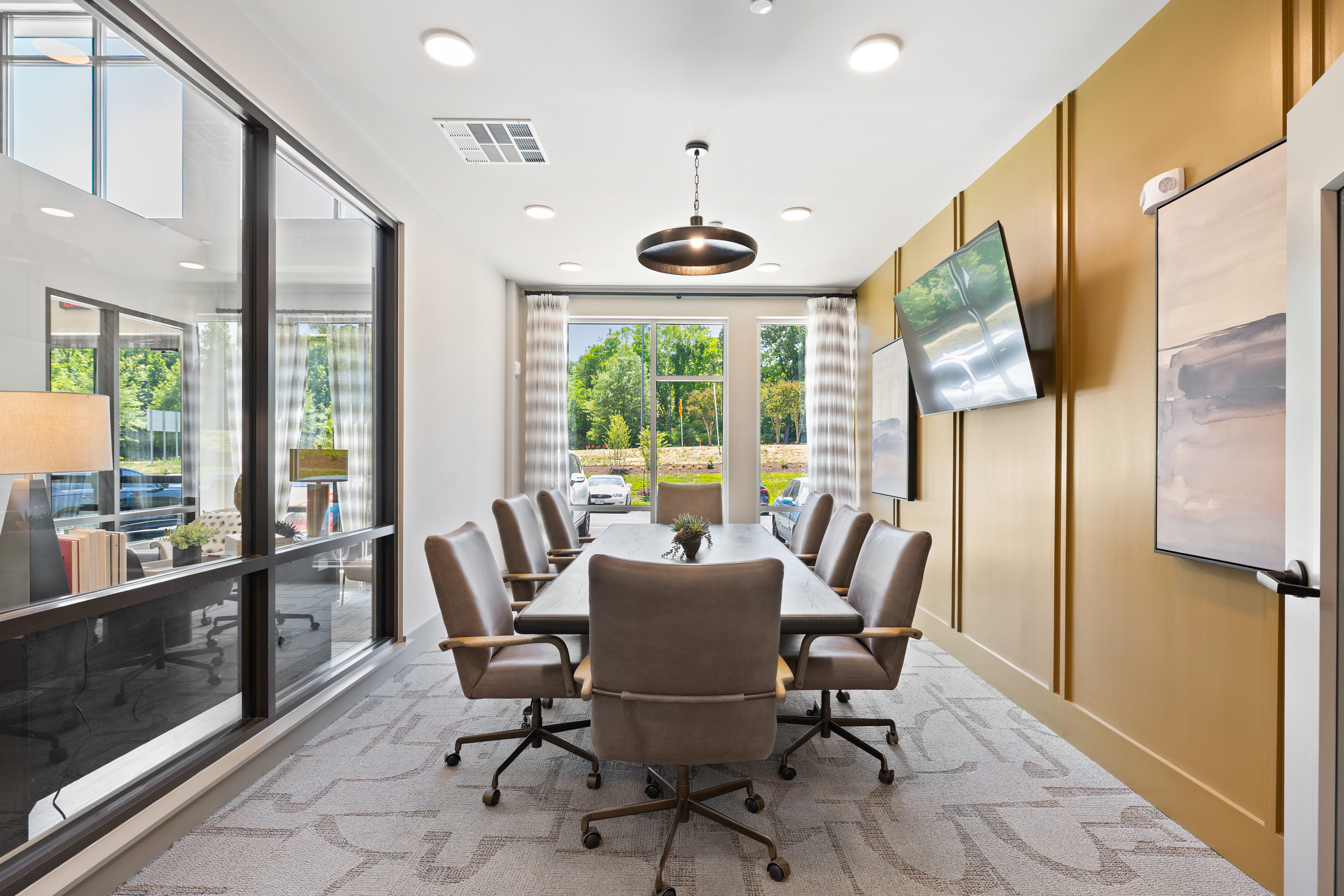 A conference room with a long table and chairs