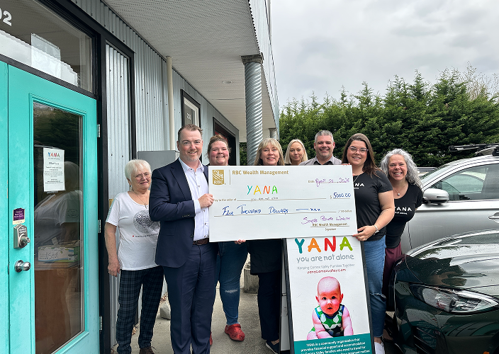 Somers team holding a cheque for YANA.