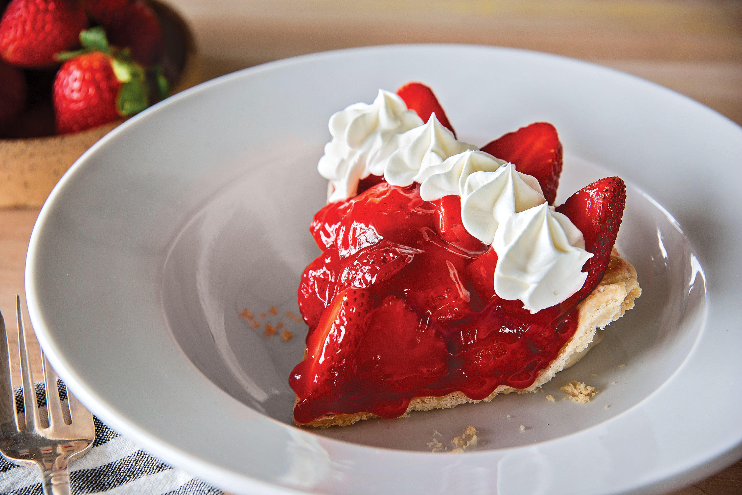 Our seasonal Strawberry Pie is a must-have over the summer! Our freshly-baked pie is made with plump, fresh strawberries in a flaky crust, mixed with our special glaze and finished with whipped topping.