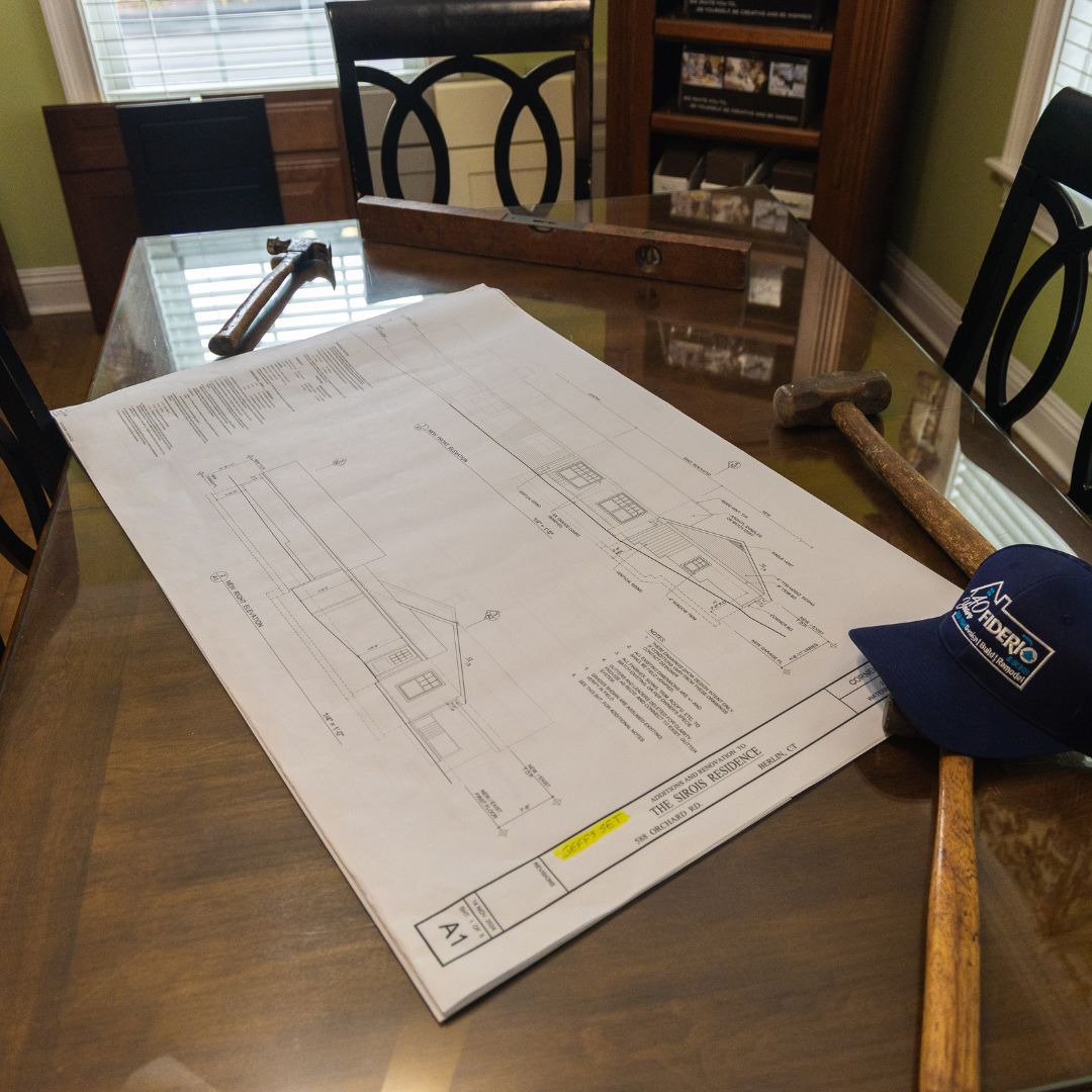 Design plans and construction tools laid out for an upcoming Fiderio remodeling project.