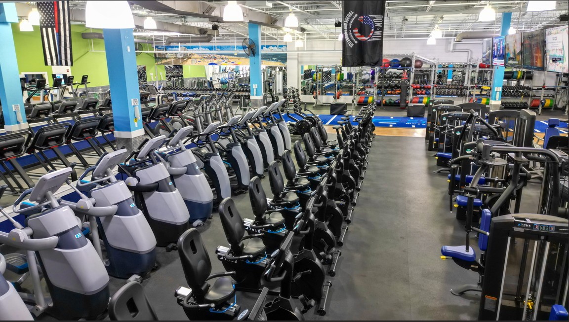 Cardio equipment section at Everyone Fitness Rehoboth Beach with ellipticals, bikes, and treadmills for every fitness level.