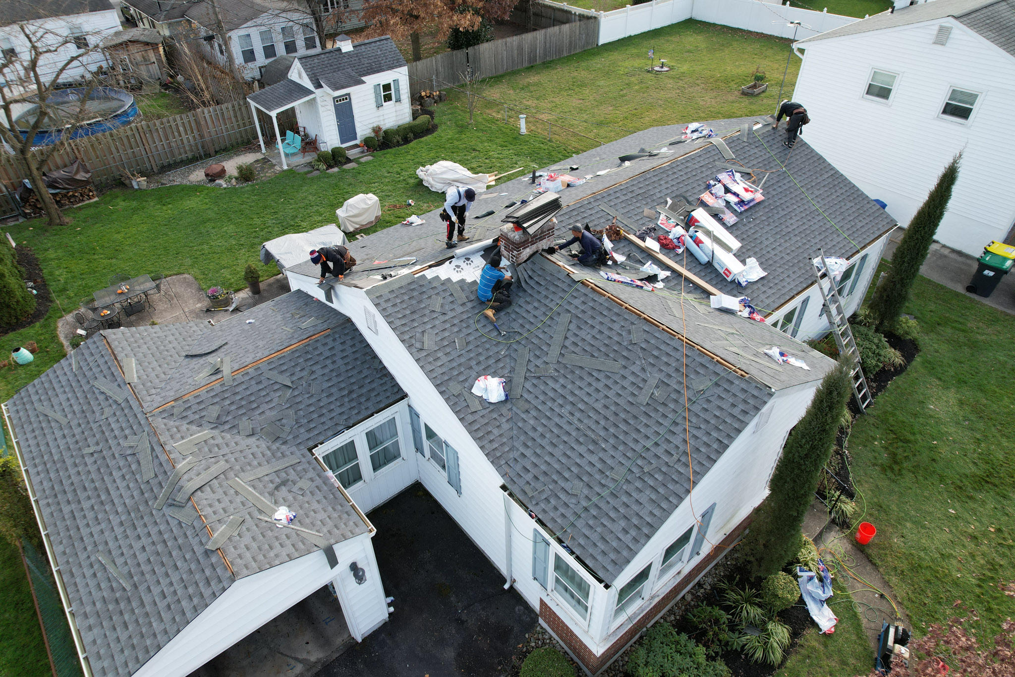 Class Roofing contractors repairing a roof