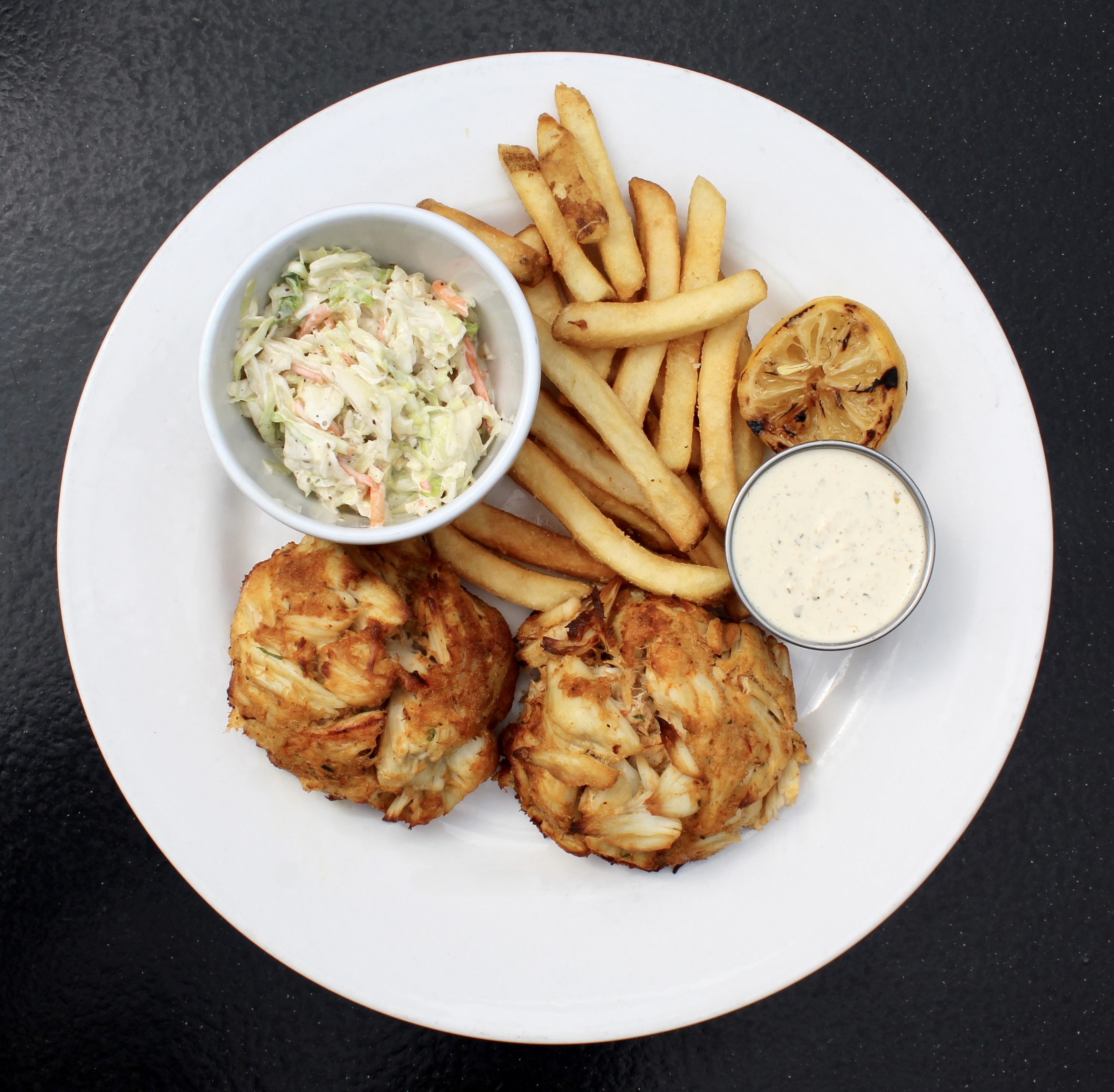 Double Crab Cake dinner served with fries, coleslaw, and tartar sauce. 