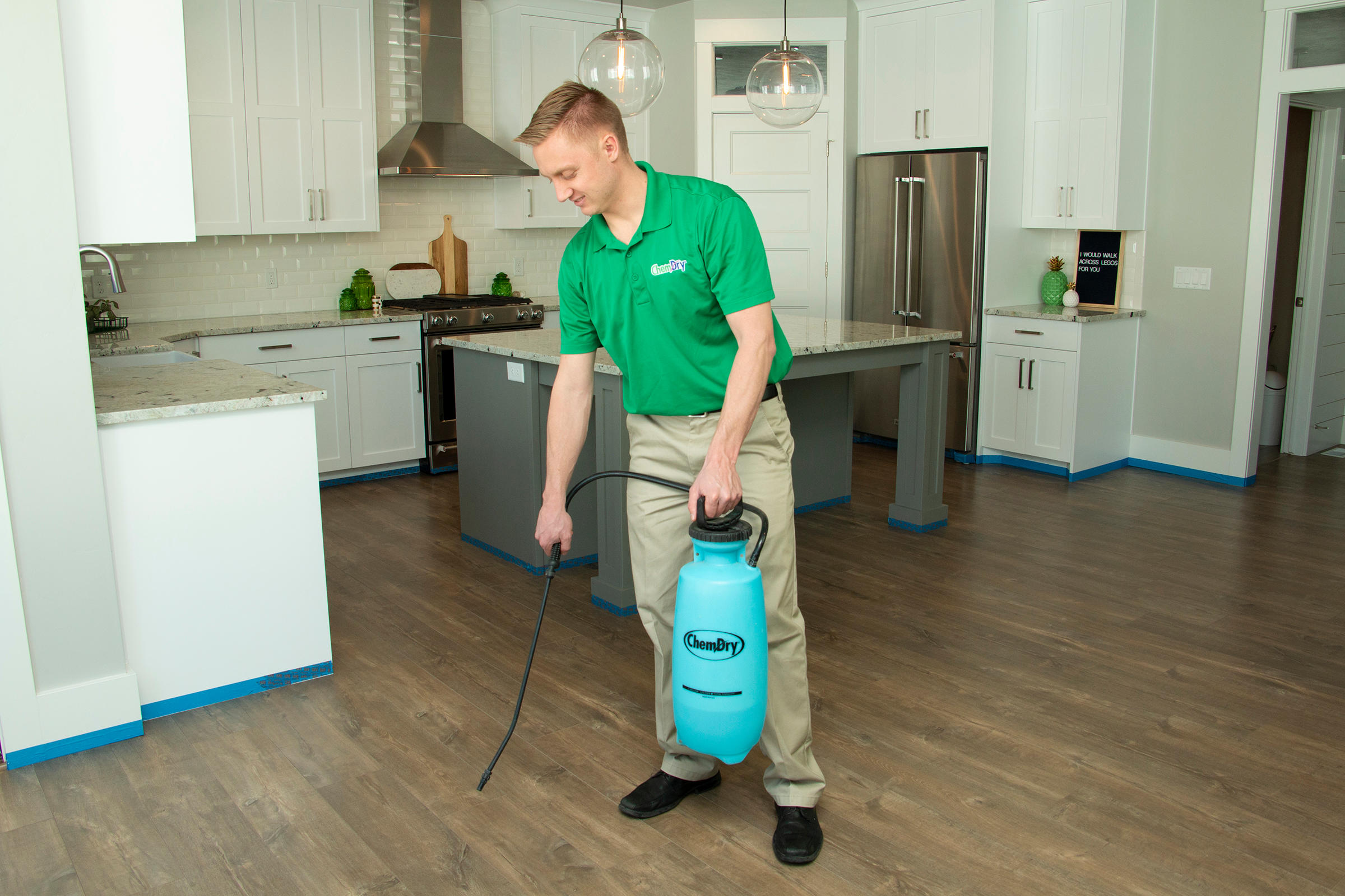 CJ's Chem-Dry tech performing wood floor cleaning in Bloomington, MN home