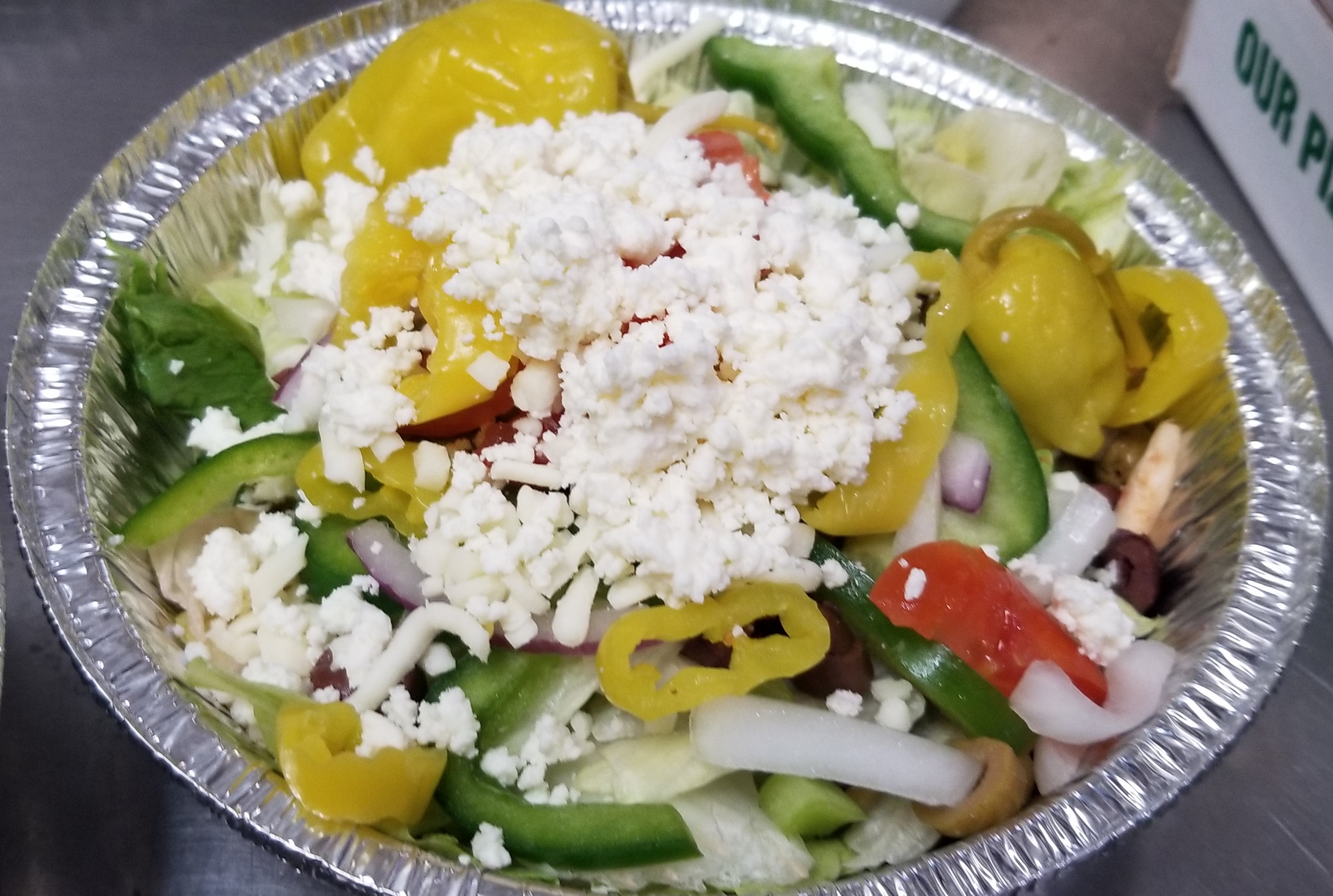 Greek Salad loaded with veggies, peppers and cheese!