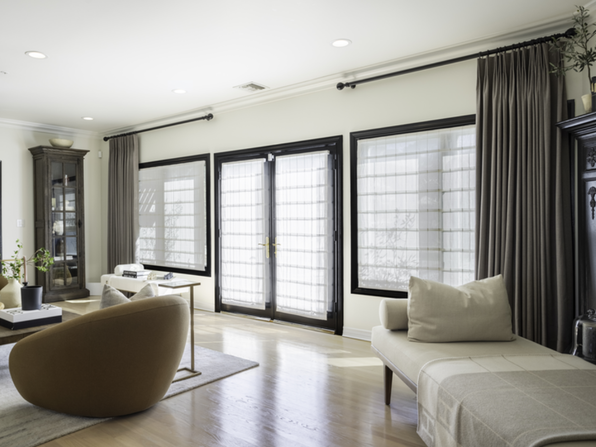 Roman Shades and Drapery Panels create a timeless, layered look, offering soft light diffusion and elegant texture while enhancing privacy and style.