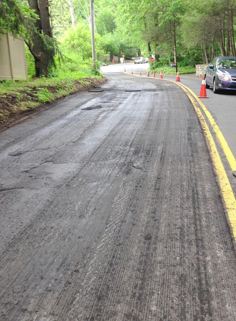 Extended roadway asphalt milling, creating a clean, even surface for high-quality paving and resurfacing.
