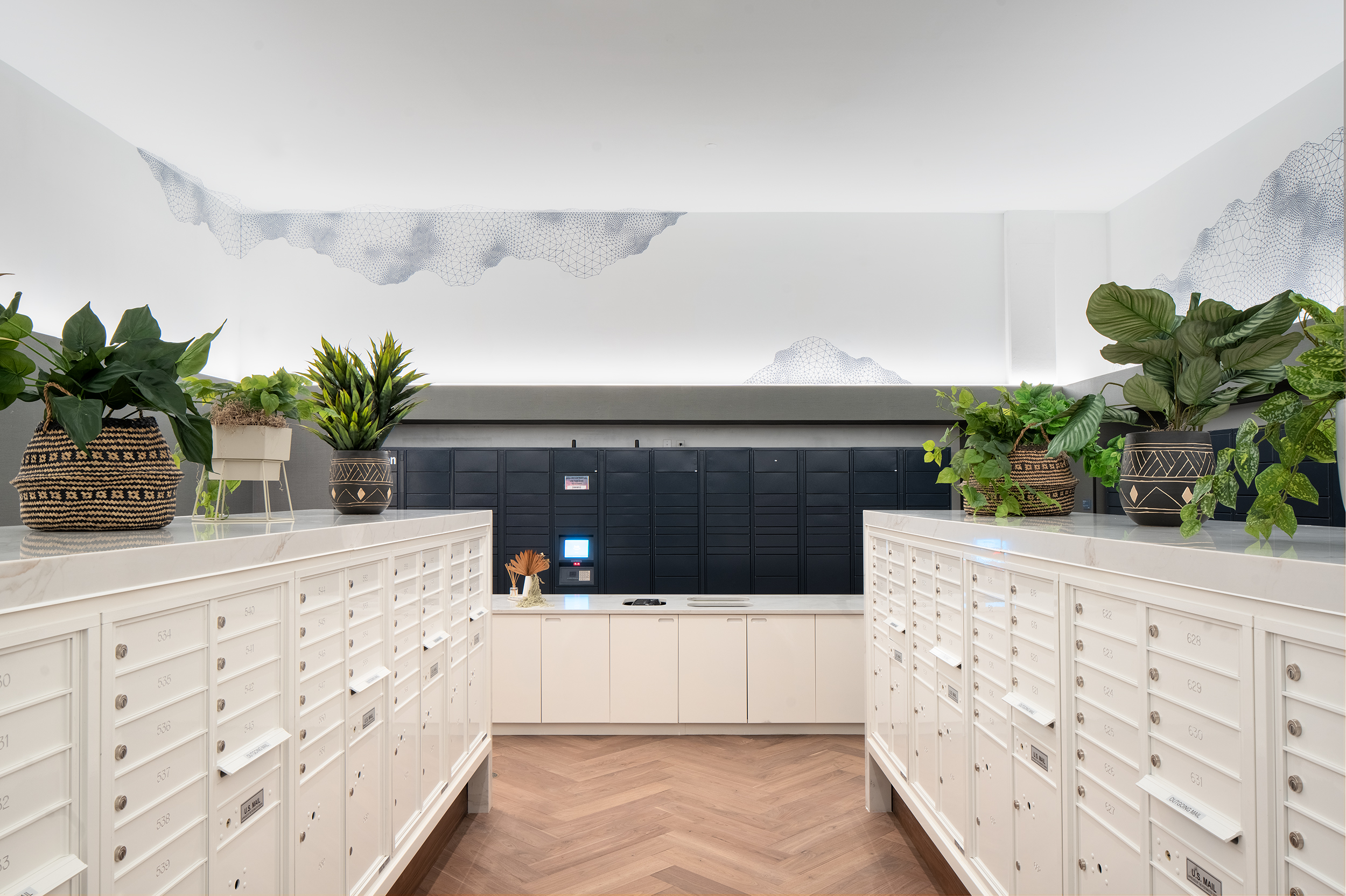 Mail room with sorting counters and package lockers