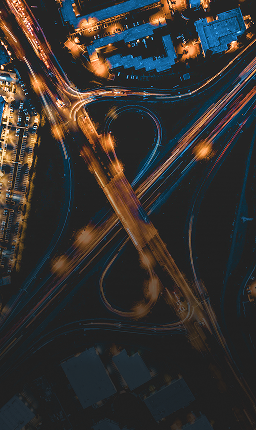 Aerial view of overlapping, curved highways.