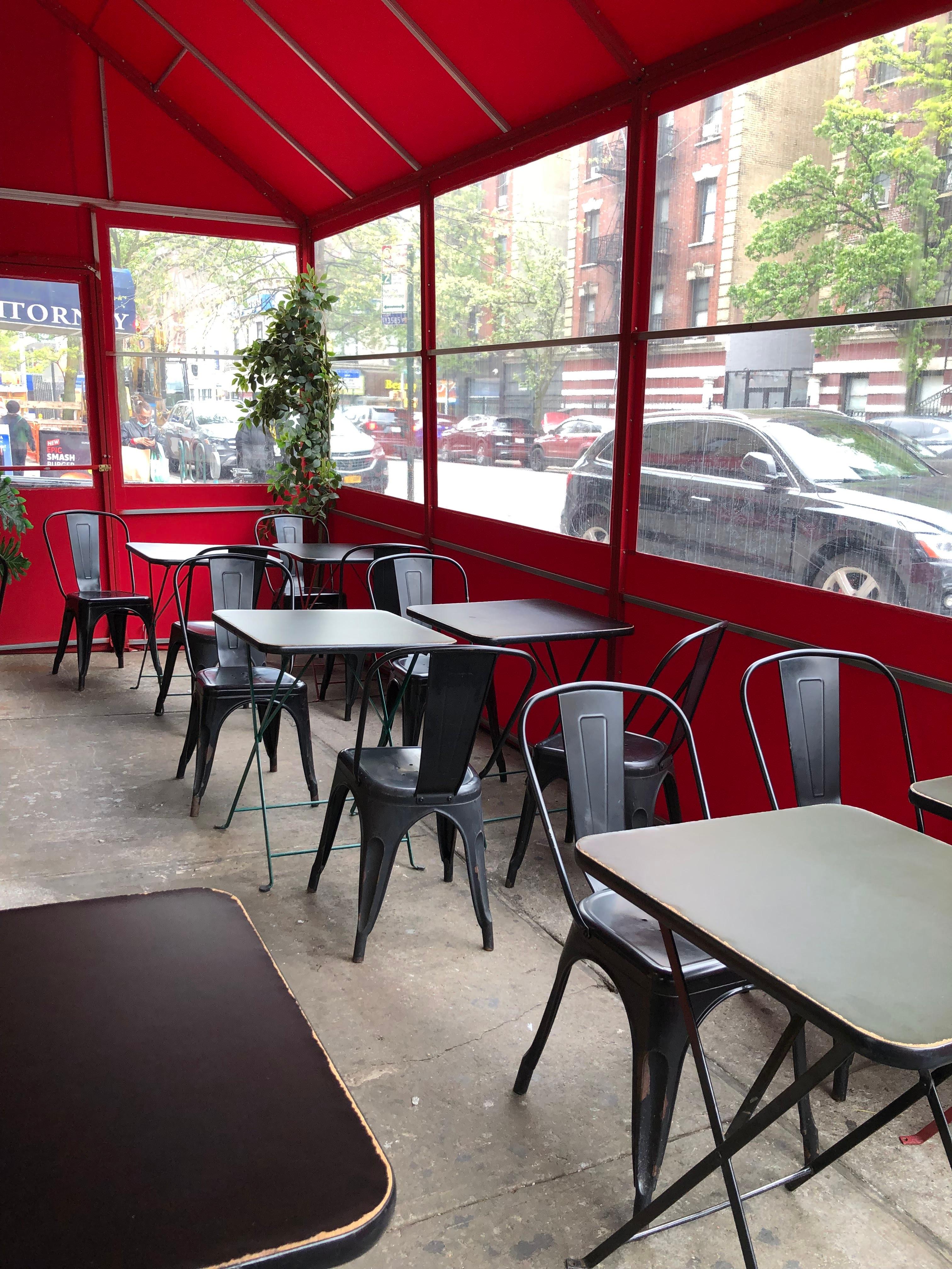 Tables in covered patio dine In area