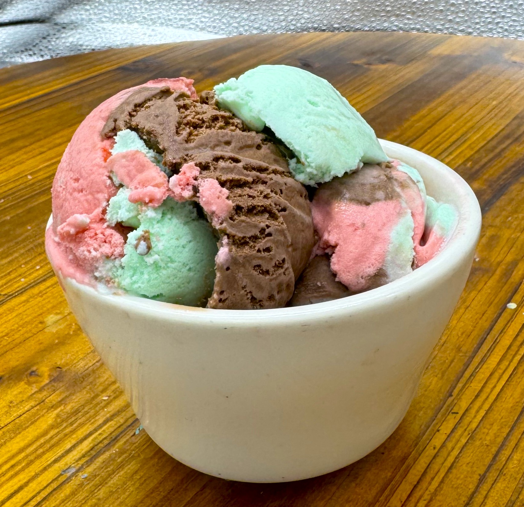 The perfect scoop of spumoni ice cream from Floridino's ready to be enjoyed. Chocolate, cherry, and pistachio flavors all mixed in to make the tastiest bite of ice cream every time!