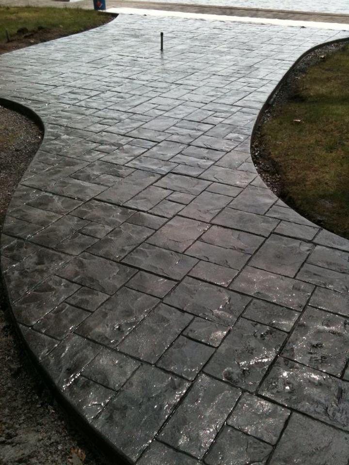 Residential sidewalk with stamped decorative concrete.