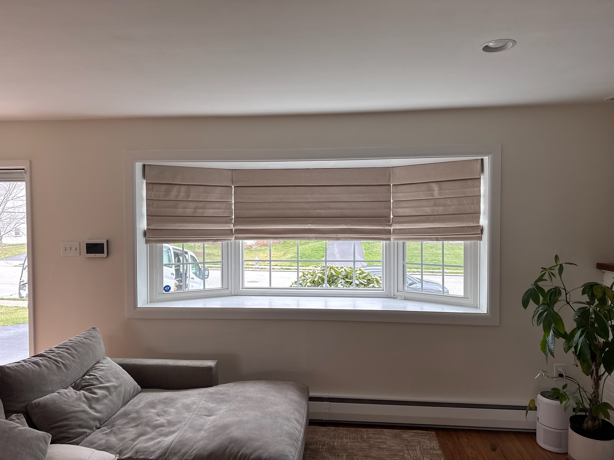 Roman shades come in a variety of fabric choices, as seen here in Geneva Shell.
