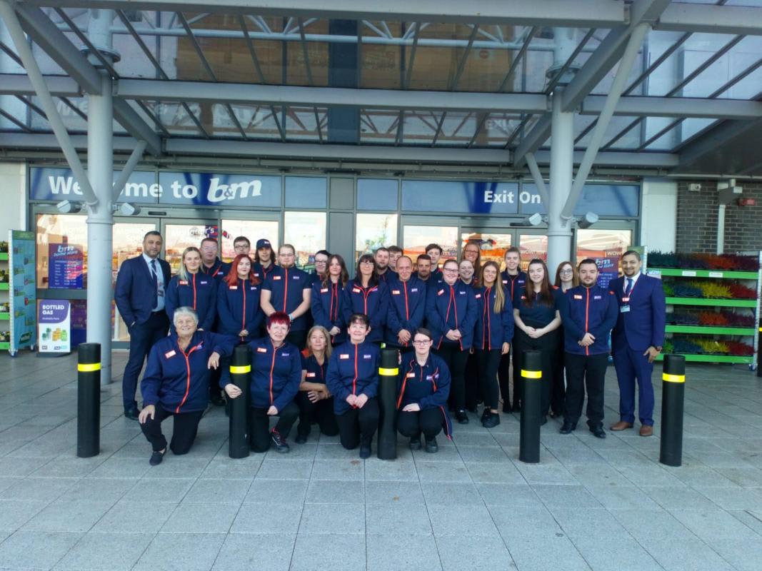 The store team at B&M's newest store in Dundee pose in front of their wonderful new Home Store & Garden Centre, located on Kingsway Retail Park, Clepington Road