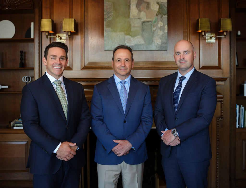 Philippe de Beaumont, Steve Foley and Alexandre Picard-Hooper standing side by side in their office.