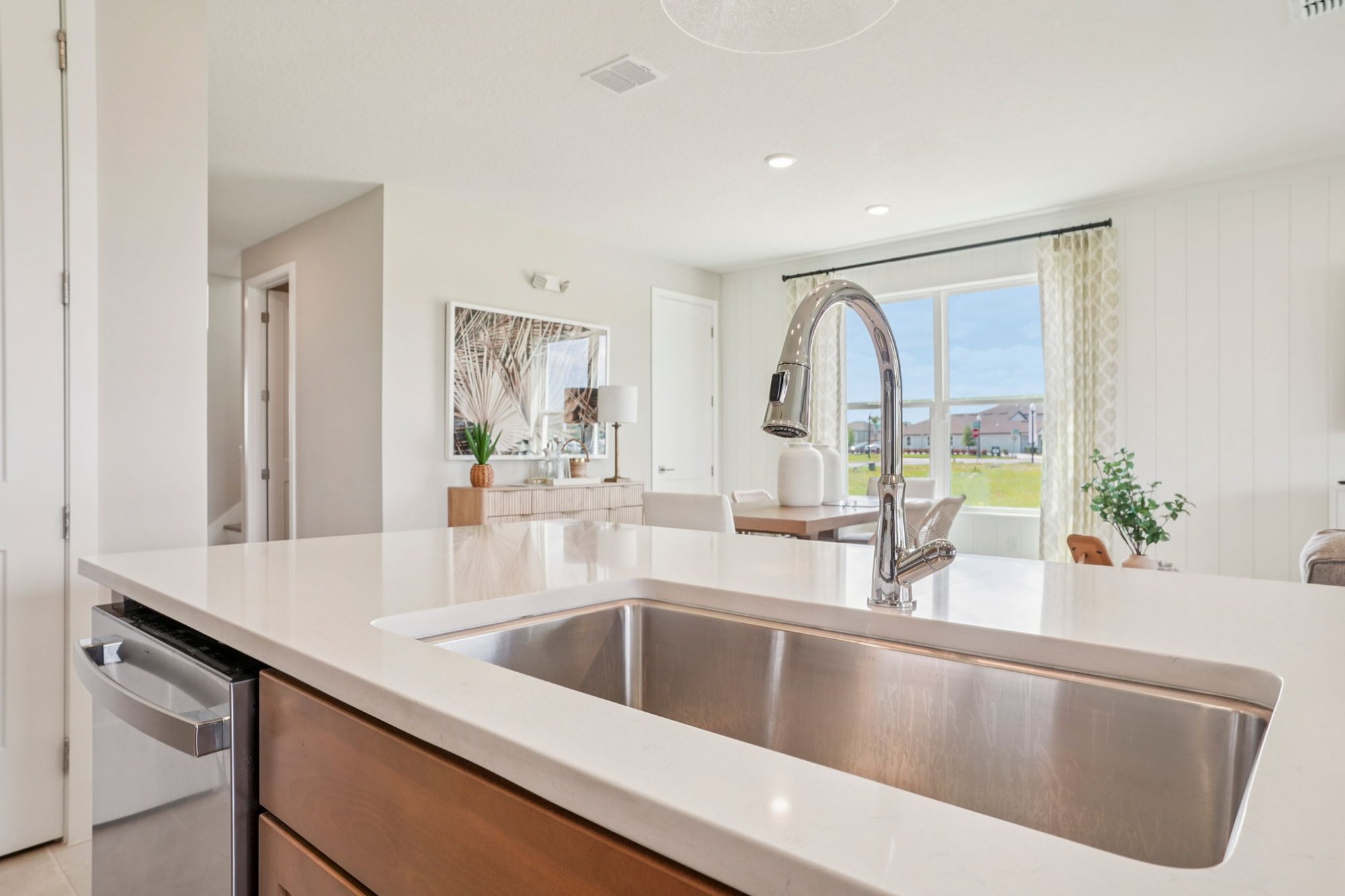 Kitchen of the DRB Homes Trailside Model Home the Sweetgum Floor Plan located in Charming Mount Dora, Florida