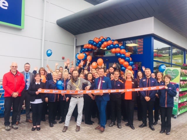 Local mayor, Councillor Tom Kirton cuts the ribbon to officially open at B&M's new store in Chepstow.