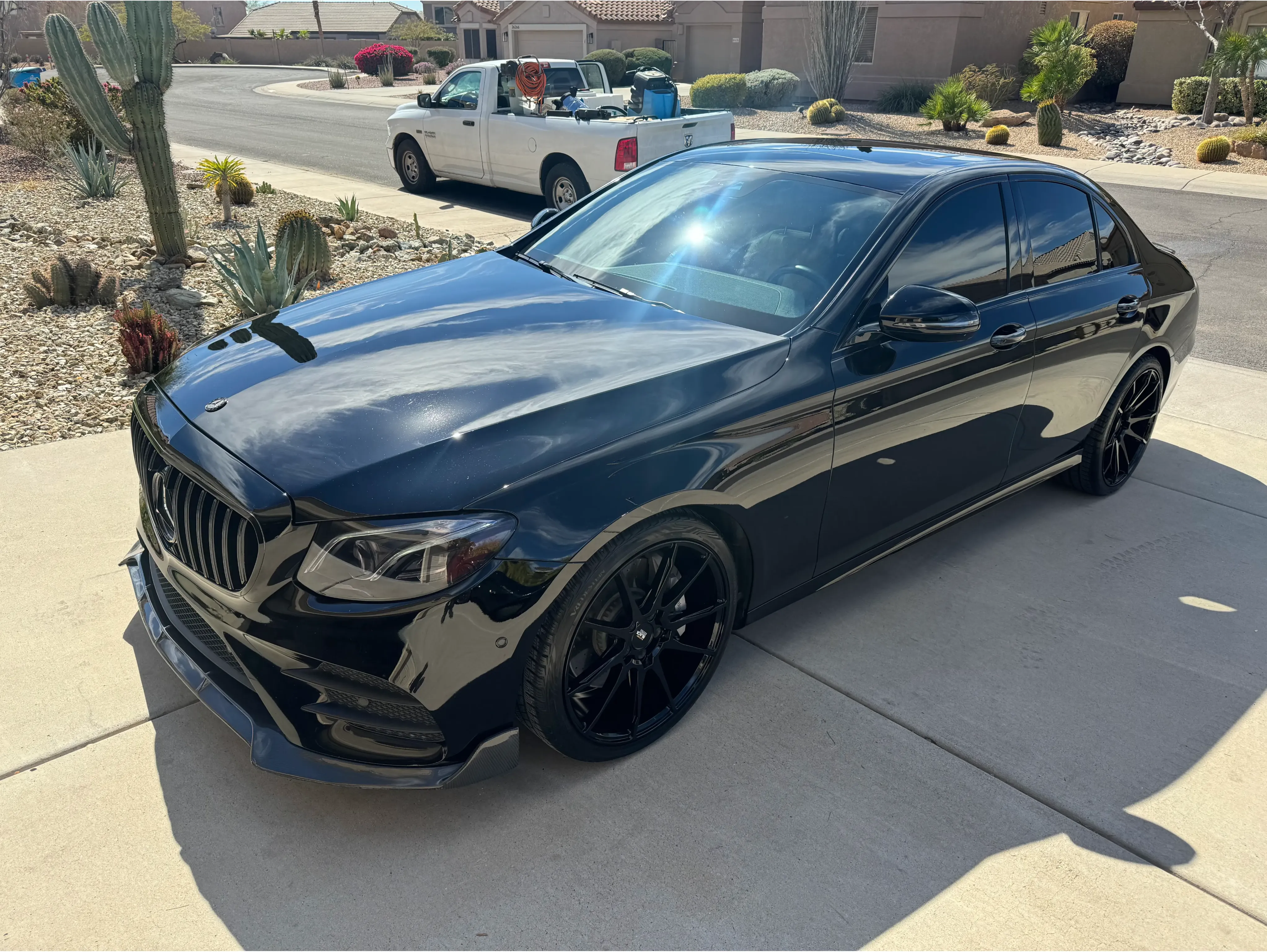 Mobile ceramic coating on a Mercedes-AMG sedan, MK Mobile Car Detailing service truck on-site in Pho 