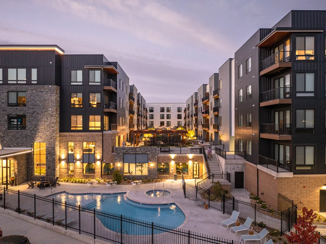 Property building with swimming pool and hot tub