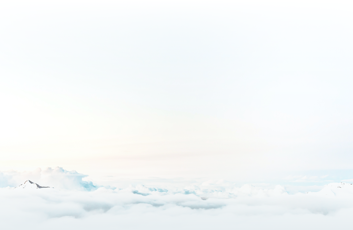 Mountain peaks peeking through the clouds.