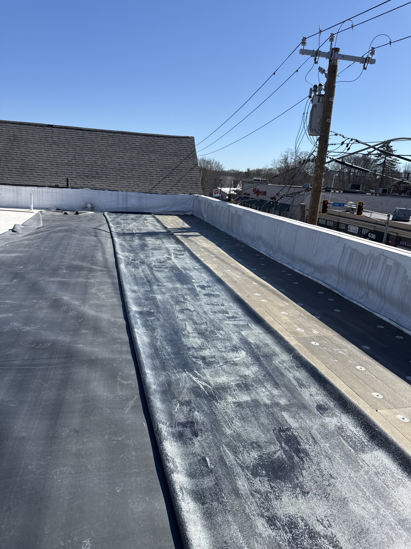 Commercial rubber roofing installation in Portland, Maine, featuring a professionally applied EPDM roofing system designed for long-term weather protection and durability.