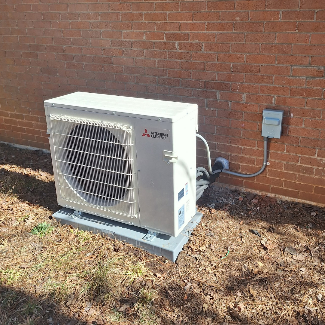Mitsubishi ductless mini-split outdoor unit installed by Dependable HVAC in Mount Gilead, NC. Expert ductless air conditioning solutions for efficient home cooling.