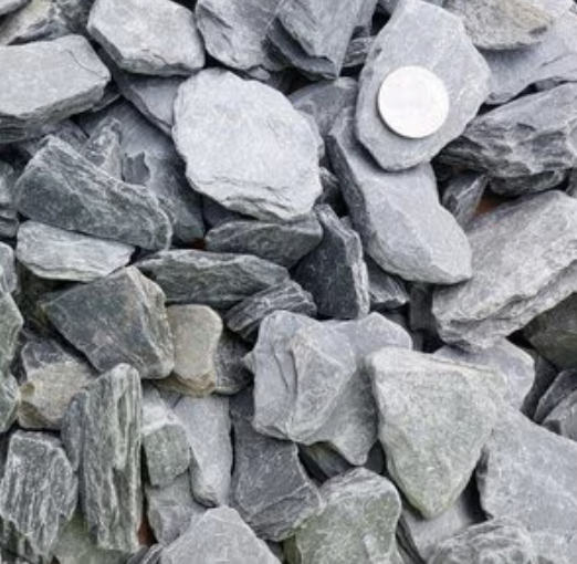 Black (Grey) Slate Chips Decorative Aggregate L-5 (3/4 - 1 1/2 in.)
Promotes excellent water drainage, reducing runoff.
Ideal for various landscaping projects and applications.
Offers a sleek, modern aesthetic.
Our Black Slate Chips are small, flat pieces of slate, also sometimes referred to as slate aggregates. They are typically used for decorative landscaping purposes, typically as the material for paths, adding a unique look to outdoor spaces.