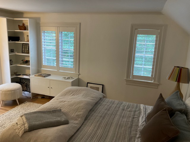 Are you dreaming of the perfect window treatment? Look no further than our Shutters. They allow you control over privacy and sun glare - creating a warm and cozy haven, as you can see in this bedroom in Pleasantville.