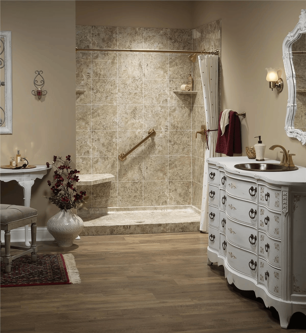 Spacious bathroom featuring a Bath Concepts walk-in shower with marble-look wall panels, built-in seating, grab bar, and a classic vanity in a warm, elegant setting
