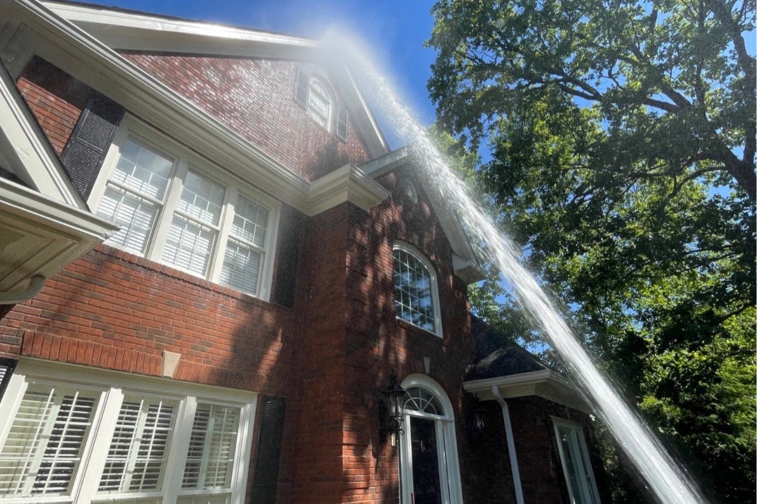 Our low-pressure house washing safely removes mold and algae at the root without forcing damaging water behind your siding.