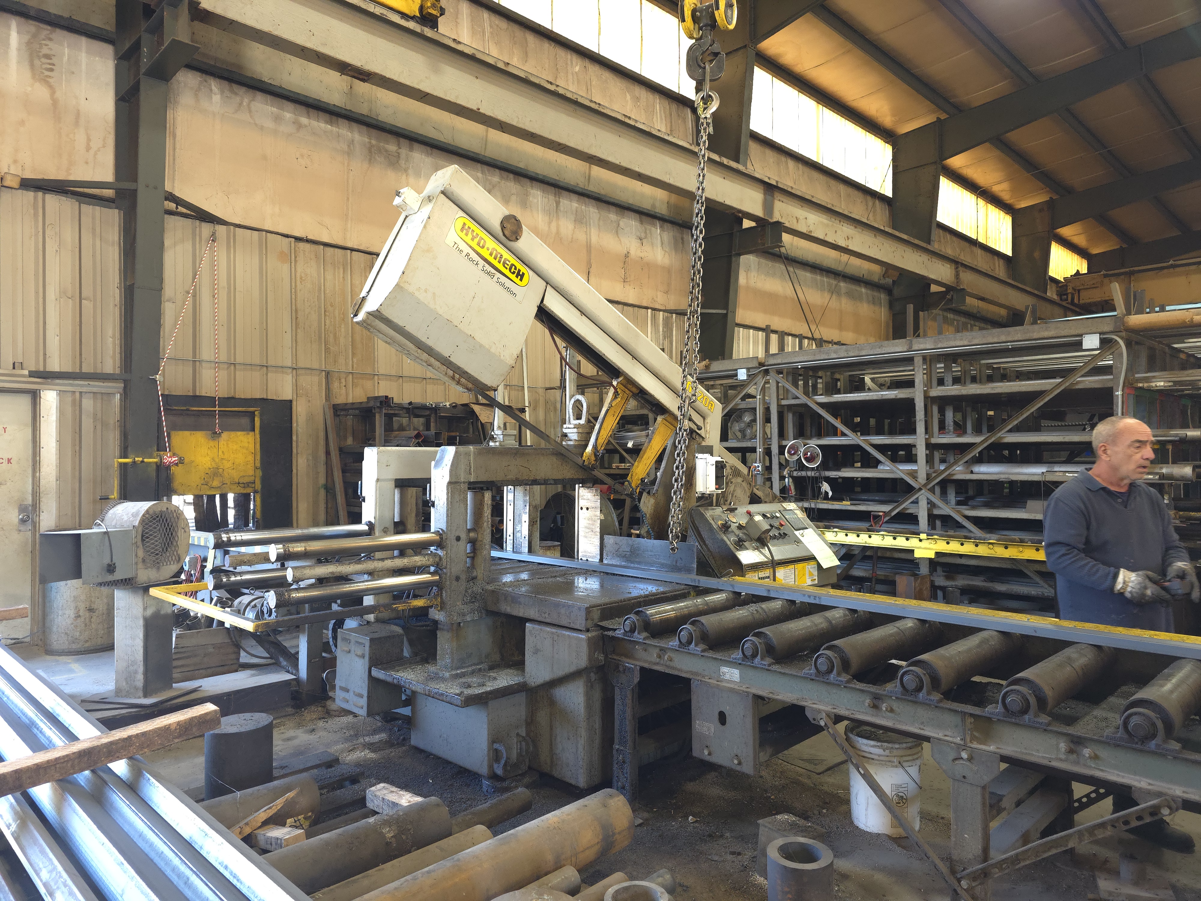 Steel band saw cutting station at Ozark Mountain Steel, used for precise cutting of structural steel, beams, and tubing. This equipment allows for accurate sizing of materials before fabrication and installation.