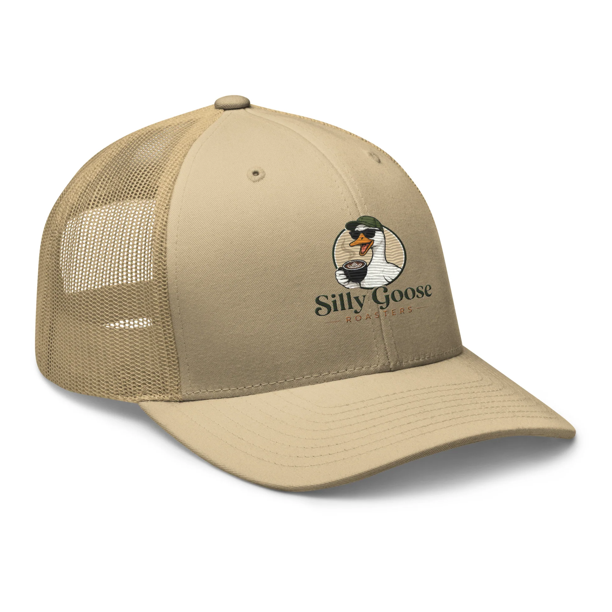 A tan trucker hat with a mesh back is displayed against a white background. The front panel of the hat features a logo with a cartoon goose wearing sunglasses and a green hat, holding a cup of coffee. The text 'Silly Goose ROASTERS' is printed below the goose graphic.