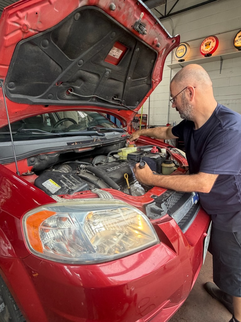 Automotive service being performed at Walker Tire Point S, 4221 S. 48th Street in Lincoln, Nebraska.