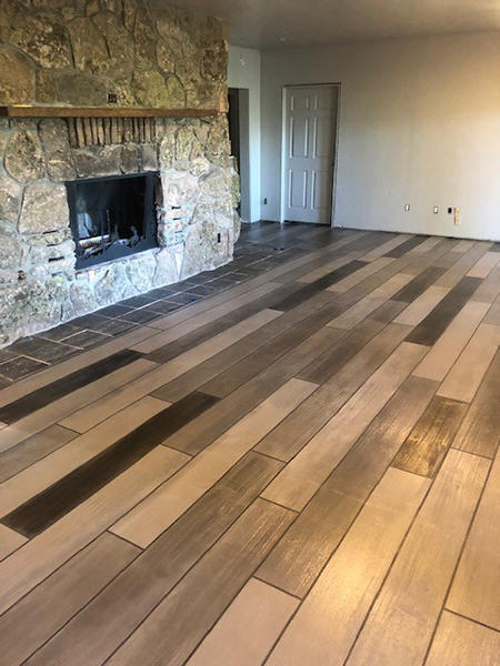 Hand Stained & Stenciled Wood Plank Concrete pattern that looks like wood floors.