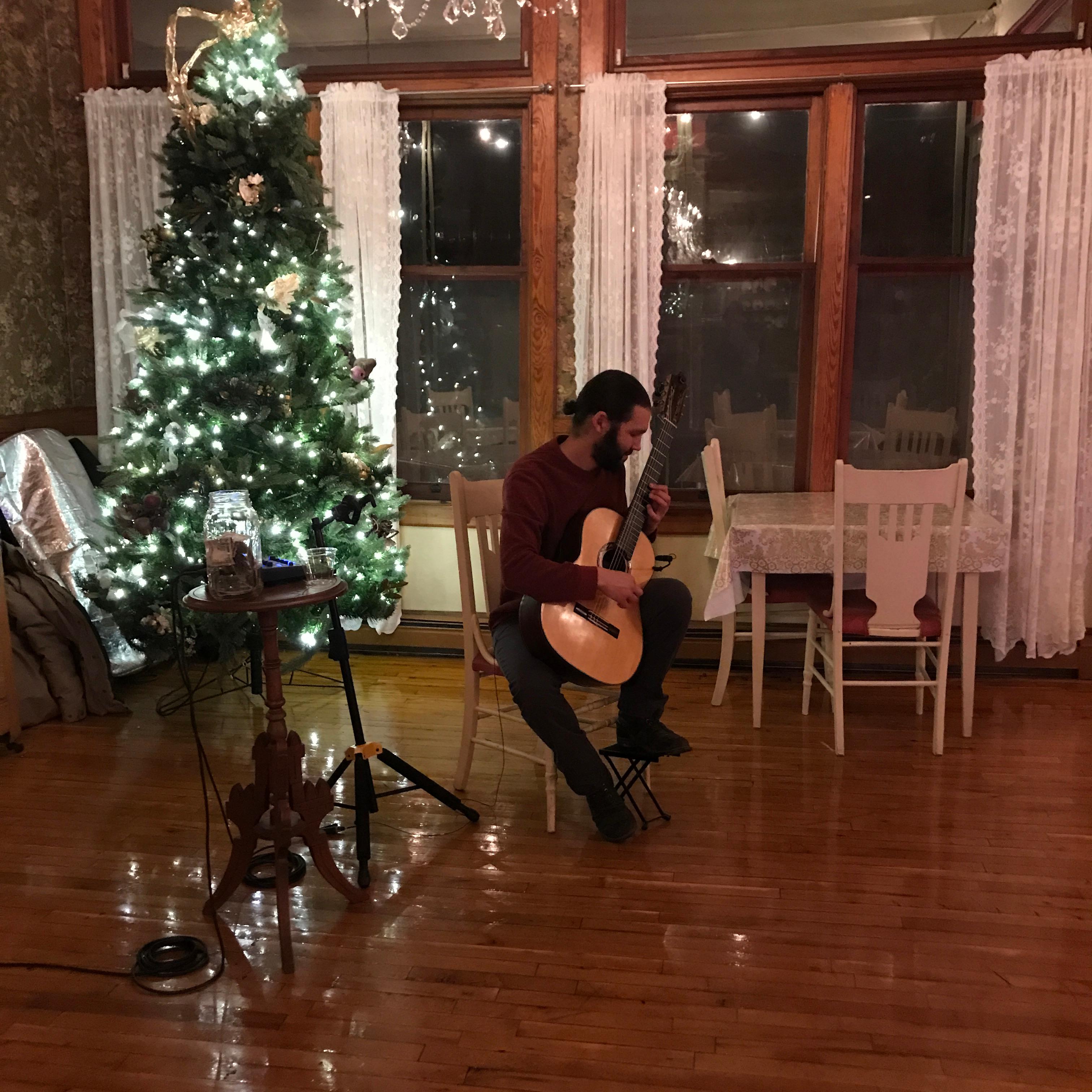 Musician playing live music in 1911 Restaurant